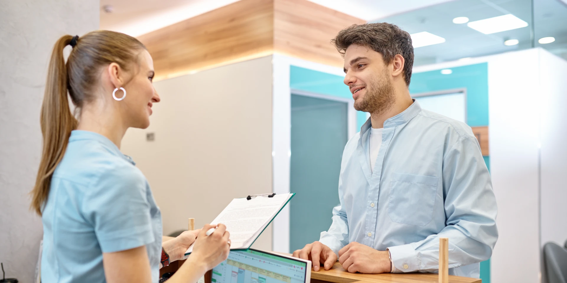 A team member welcoming a patient