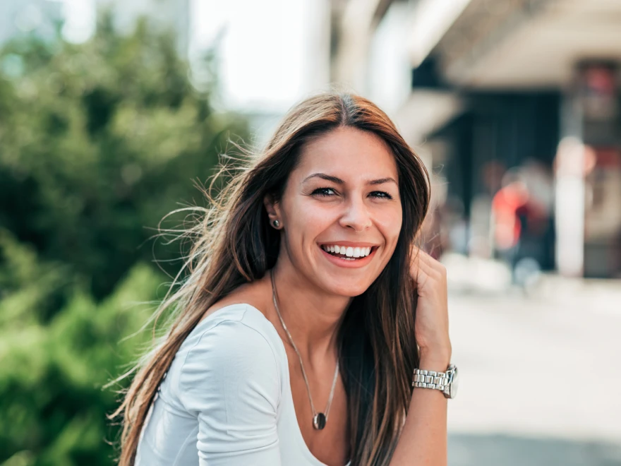 A smiling woman outdoors