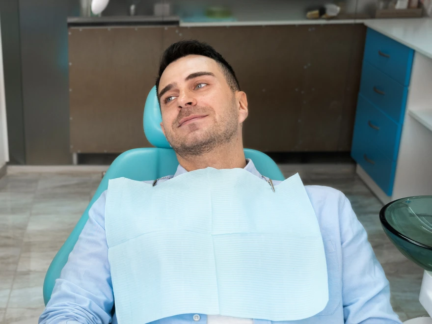 A patient reclining in the dental chair