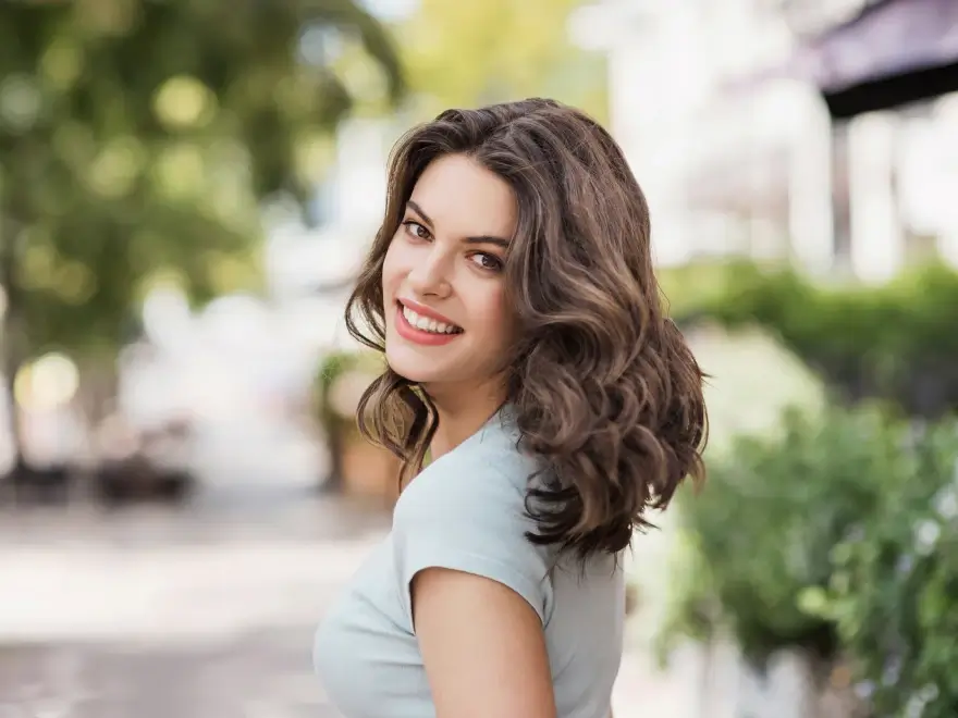A smiling woman outdoors