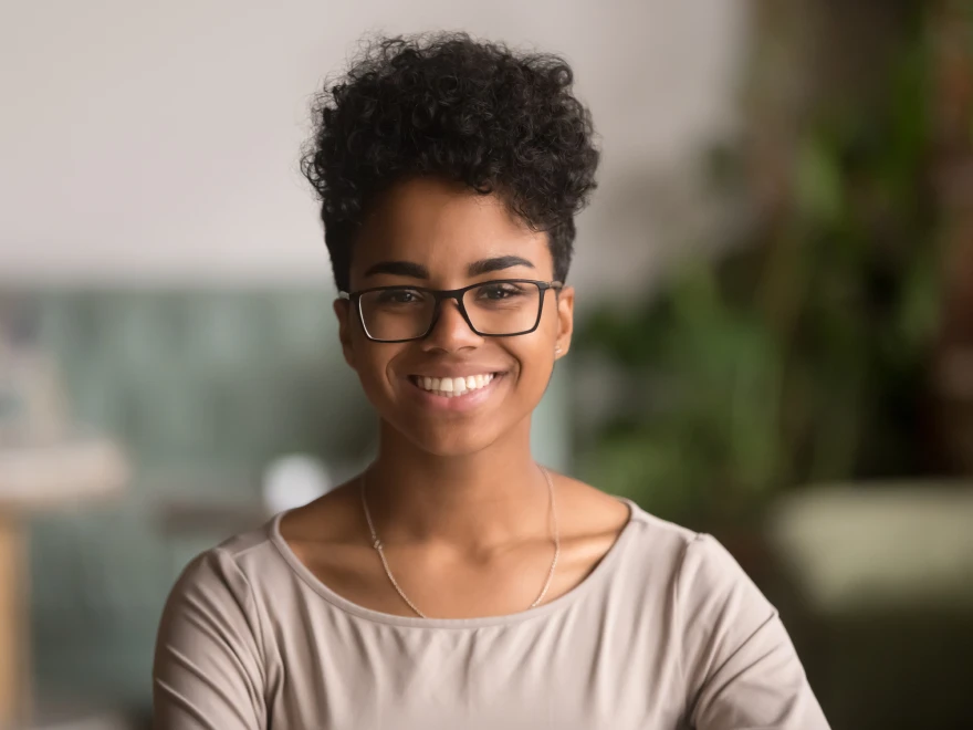 A smiling woman with glasses