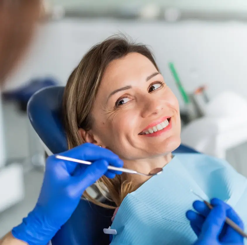 A smiling patient during a dental exam